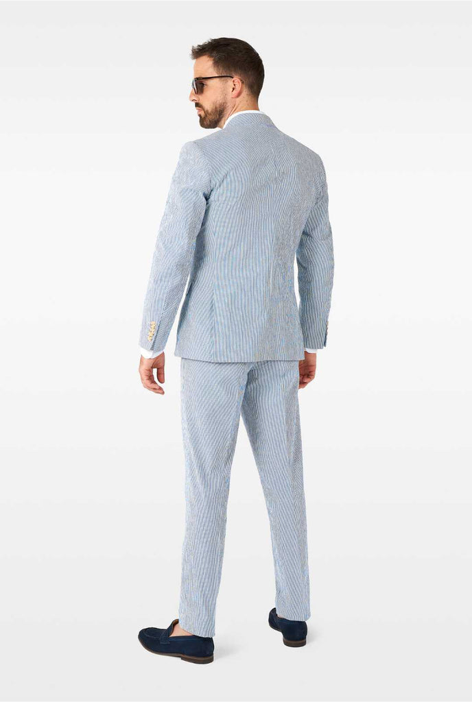 Man wearing stripped blue and white seer sucker suit