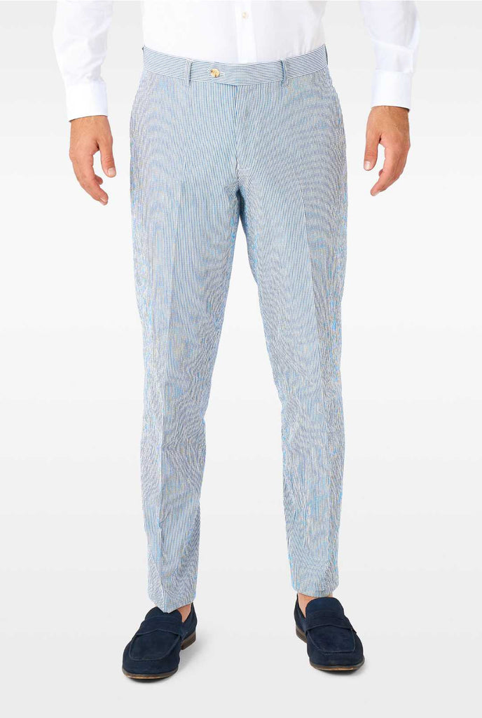 Man wearing stripped blue and white seer sucker suit