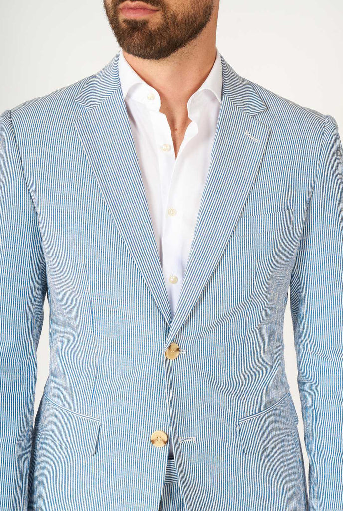 Man wearing stripped blue and white seer sucker suit