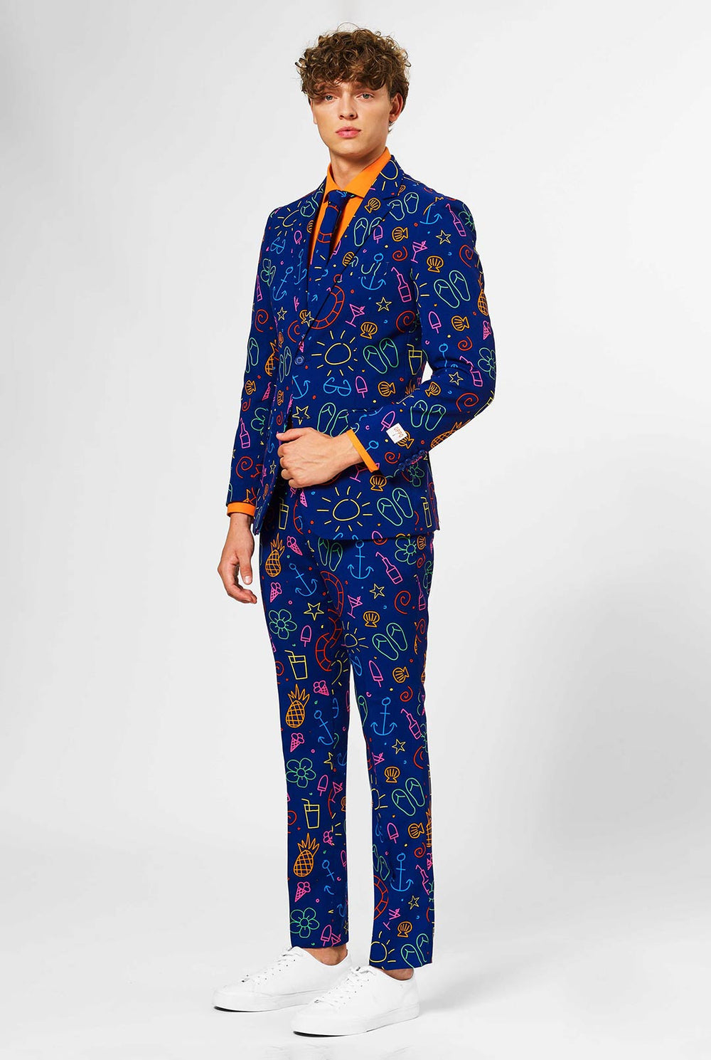 Dark blue men's suit with bright doodle iconography worn by man