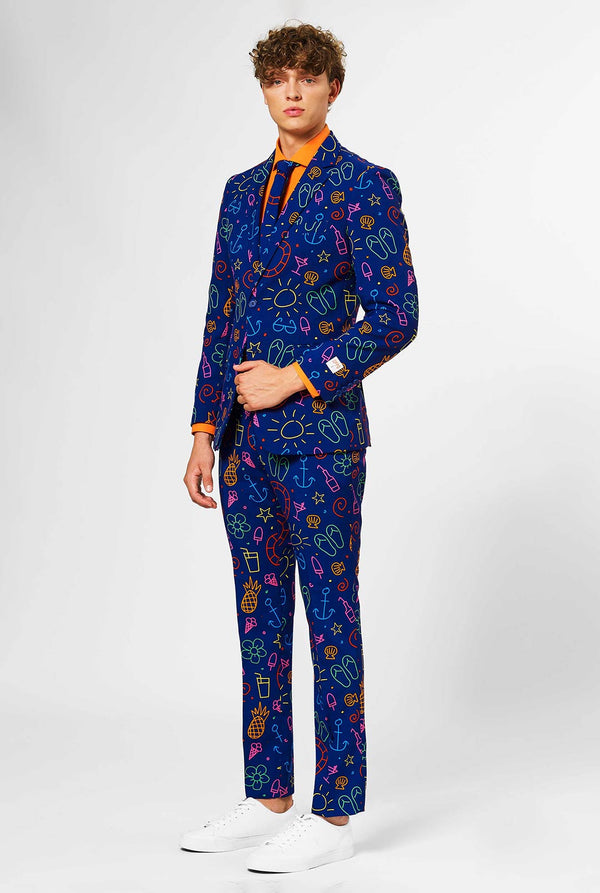 Dark blue men's suit with bright doodle iconography worn by man
