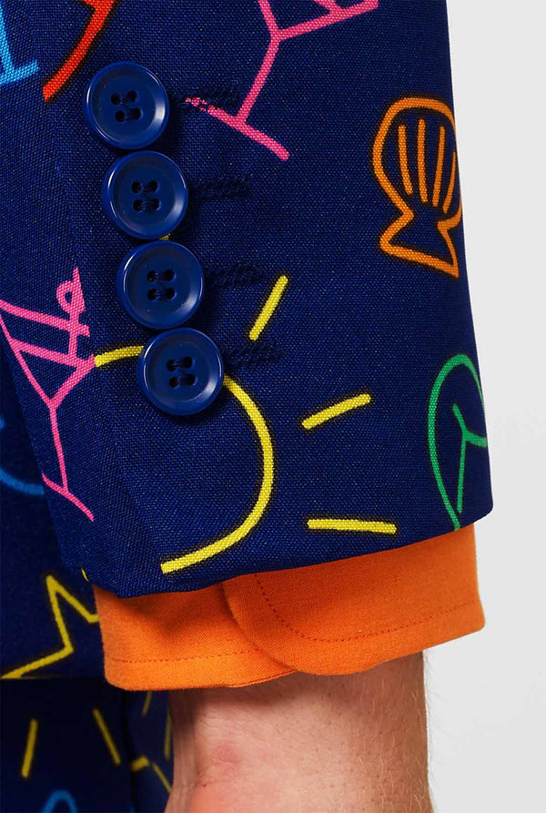 Dark blue men's suit with bright doodle iconography worn by man