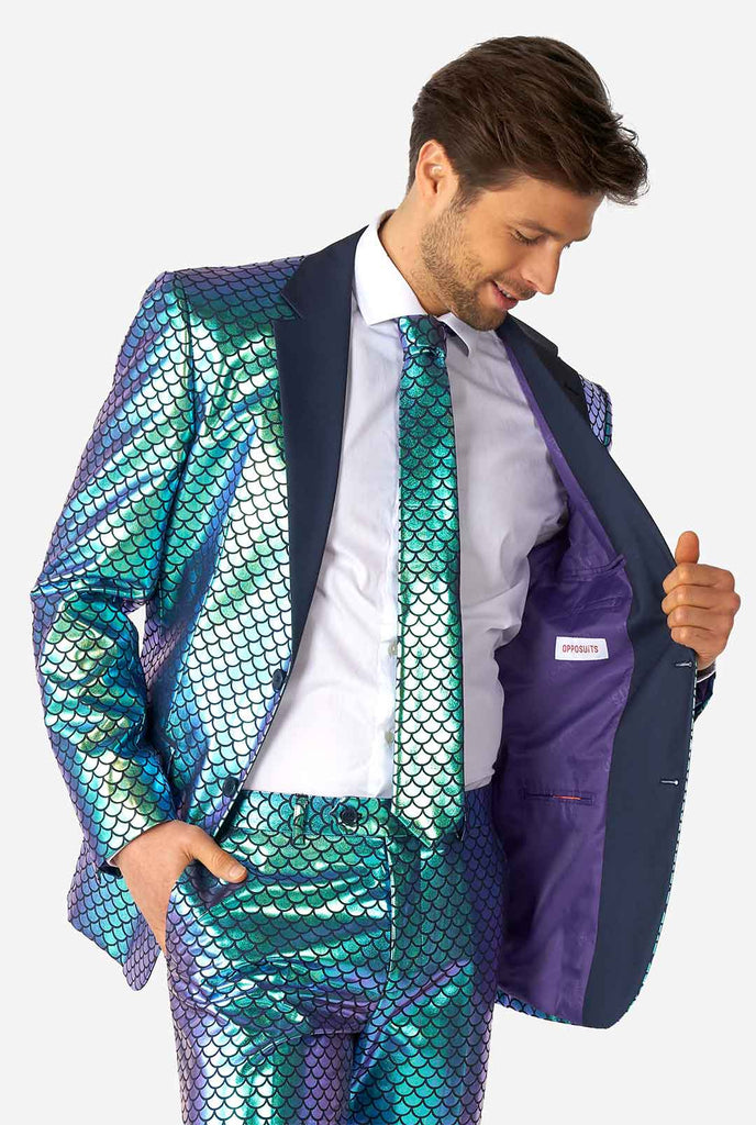 Man wearing blue fish scale motive suit