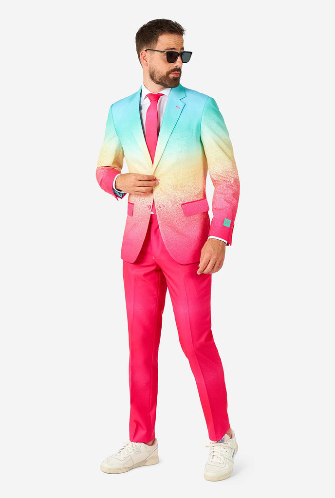 Man wearing rainbow colored suit