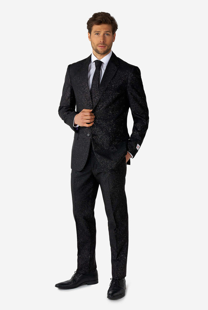 Man wearing black suit with glitter