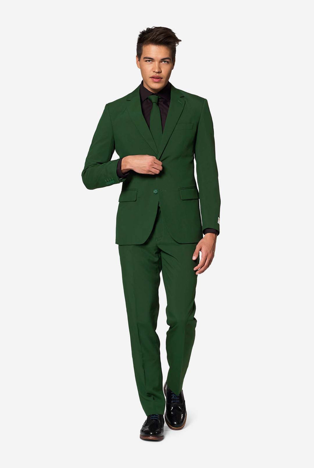 Stylish man wearing OppoSuits Glorious Green slim fit suit with black dress shirt and matching green tie — modern men’s formal wear.