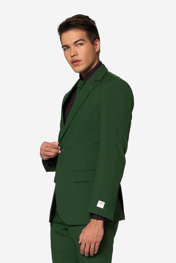 Profile view of man buttoning OppoSuits Glorious Green blazer with visible OPPO label — bold and stylish green suit for men.