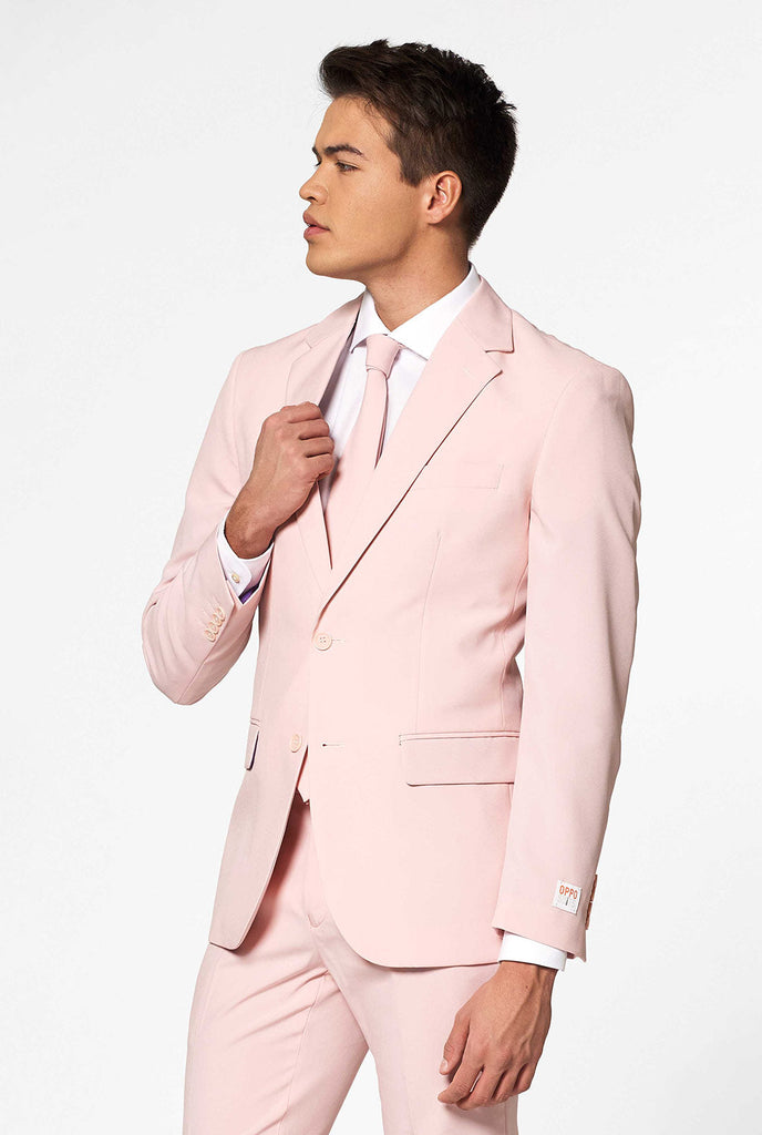 Man wearing pastel pink colored men's suit