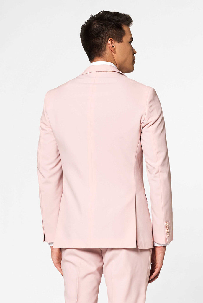 Man wearing pastel pink colored men's suit