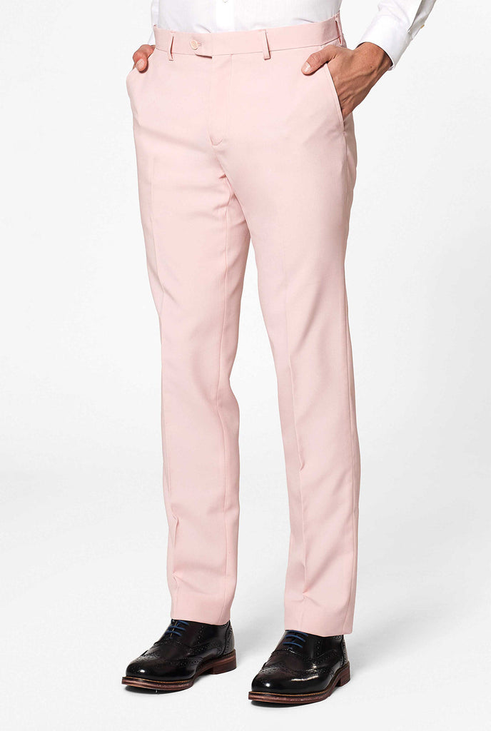 Man wearing pastel pink colored men's suit