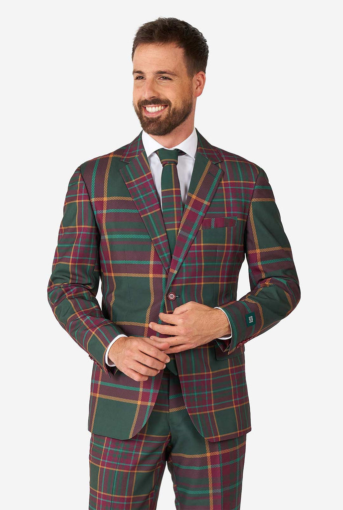 Man wearing a tartan plaid Christmas suit