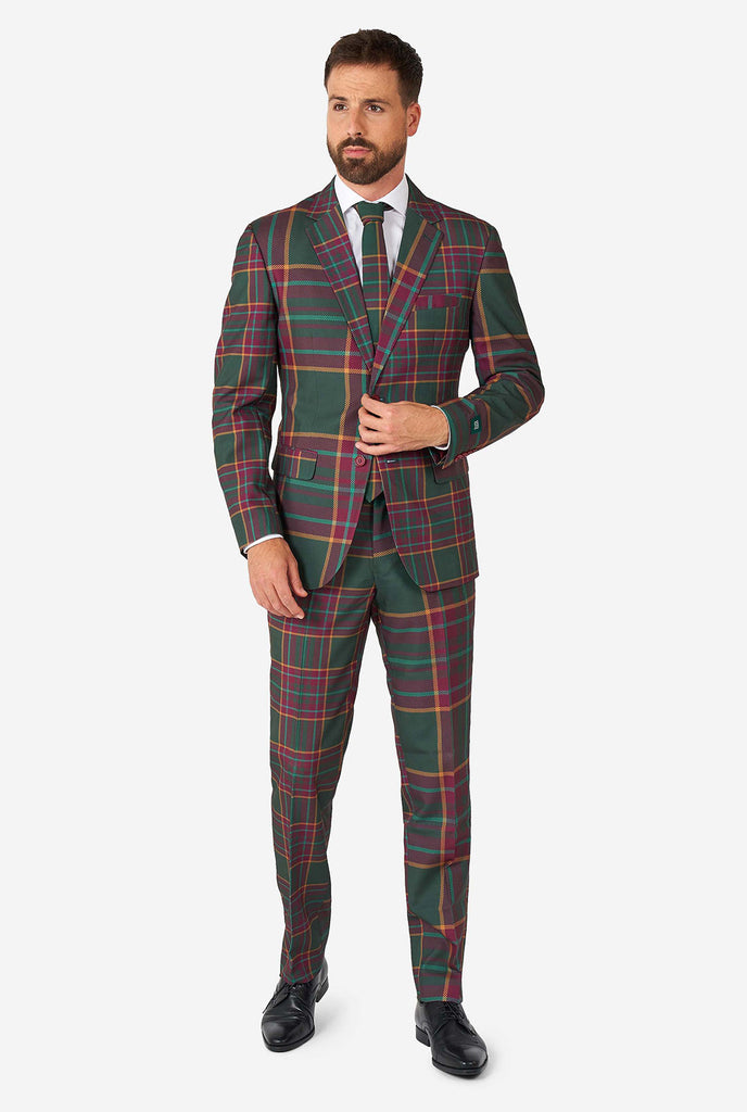 Man wearing a tartan plaid Christmas suit