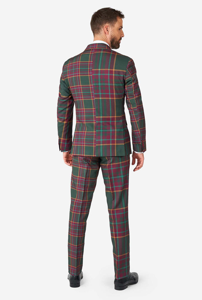 Man wearing a tartan plaid Christmas suit