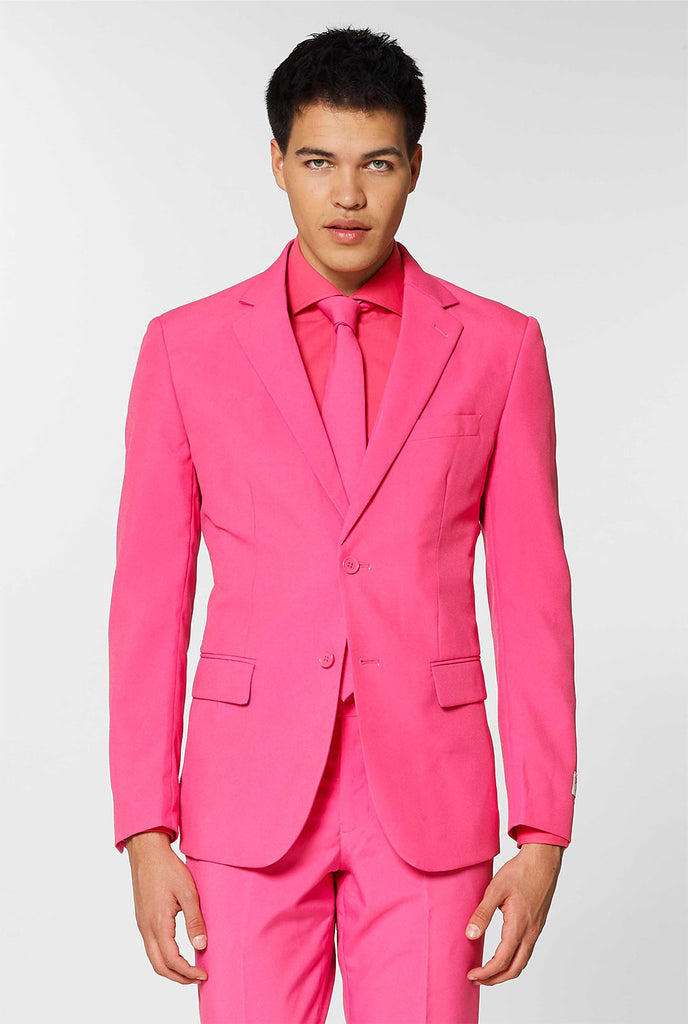 Man wearing pink men's suit with pink dress shirt