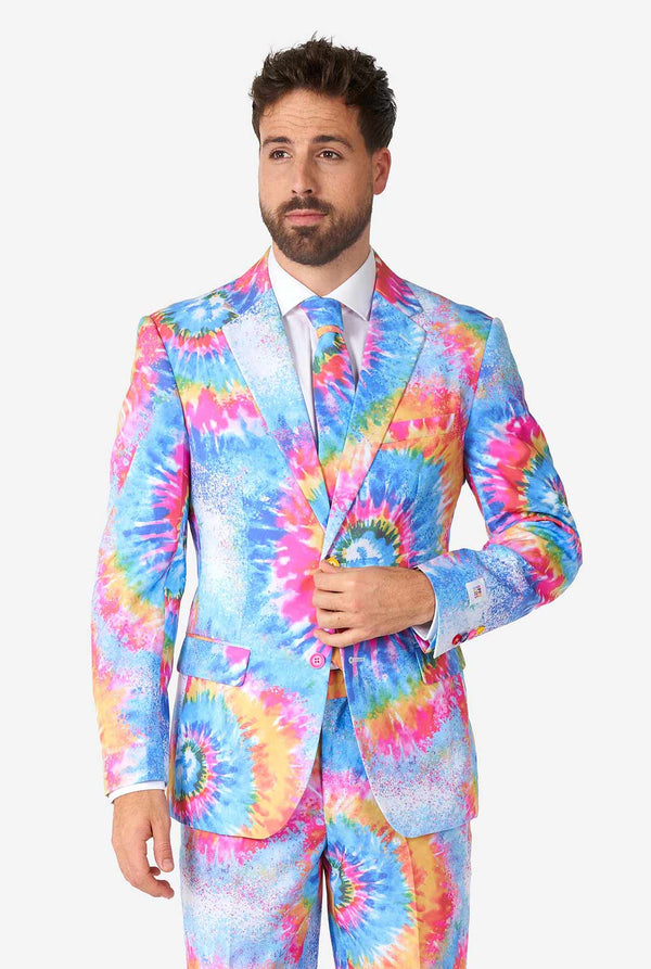 Man wearing pride men's suit with colorful tie dye rainbow print 