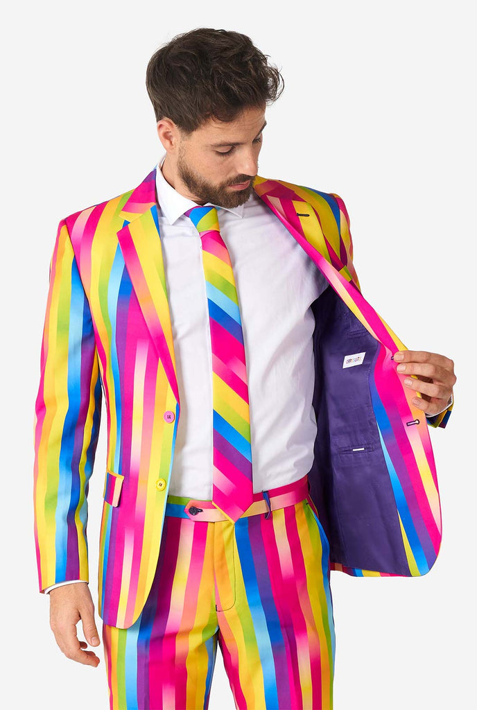 Man wearing rainbow-colored suit