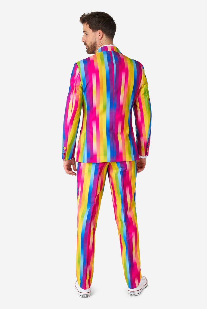 Man wearing rainbow-colored suit