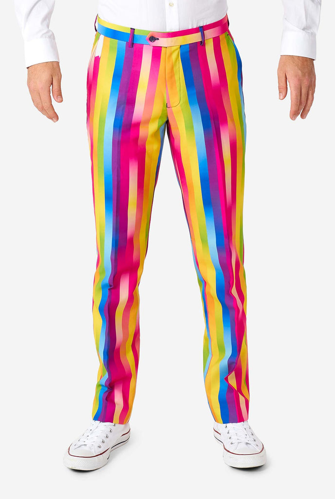 Man wearing rainbow-colored suit