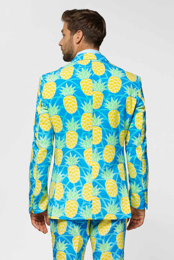 Pineapple print men's suit with bright colors by man close up