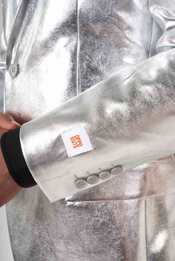 Man wearing shiny silver suit 