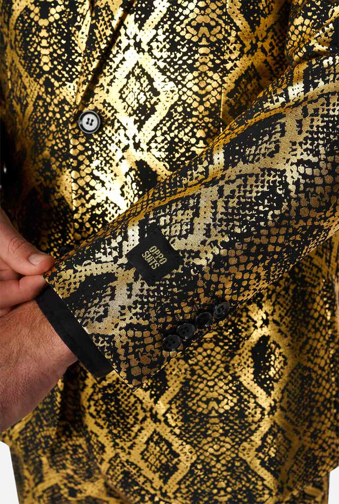 Man wearing suit with, gold and black, snakeskin print