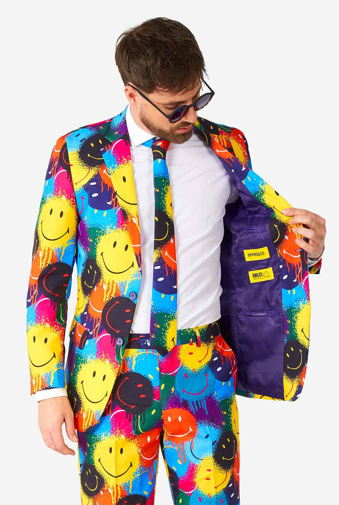 Man wearing colorful men's suit with Smiley print