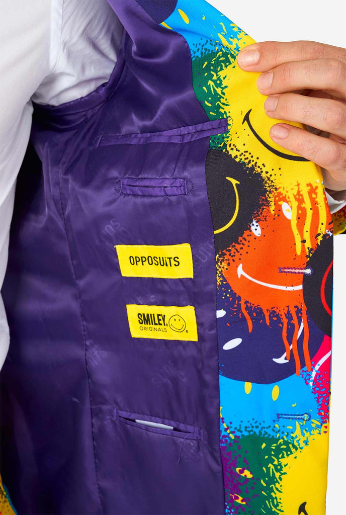Man wearing colorful men's suit with Smiley print