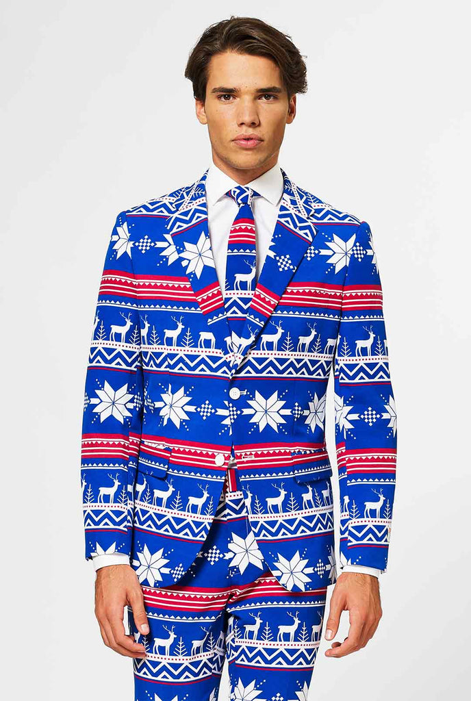 Man wearing blue Christmas suit with Nordic themed print