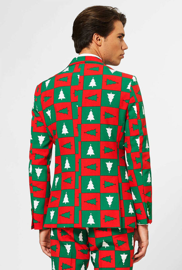 Man wearing red and green Christmas suit