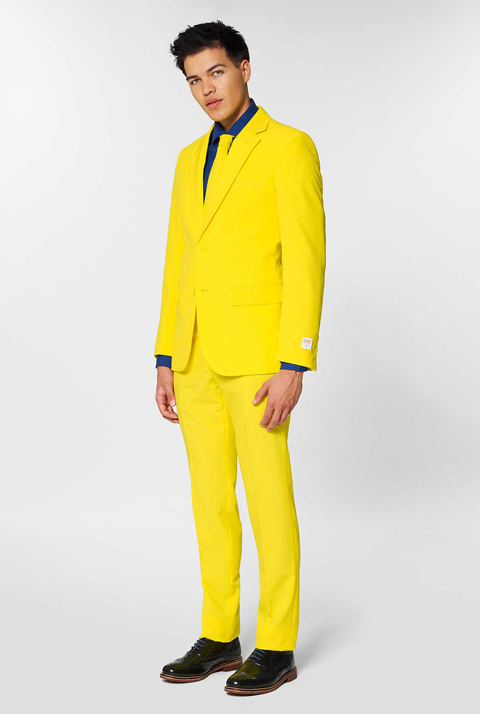 Man wearing yellow men's suit and dark blue dress shirt