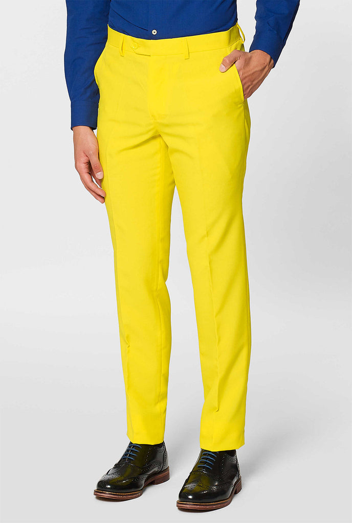 Man wearing yellow men's suit and dark blue dress shirt