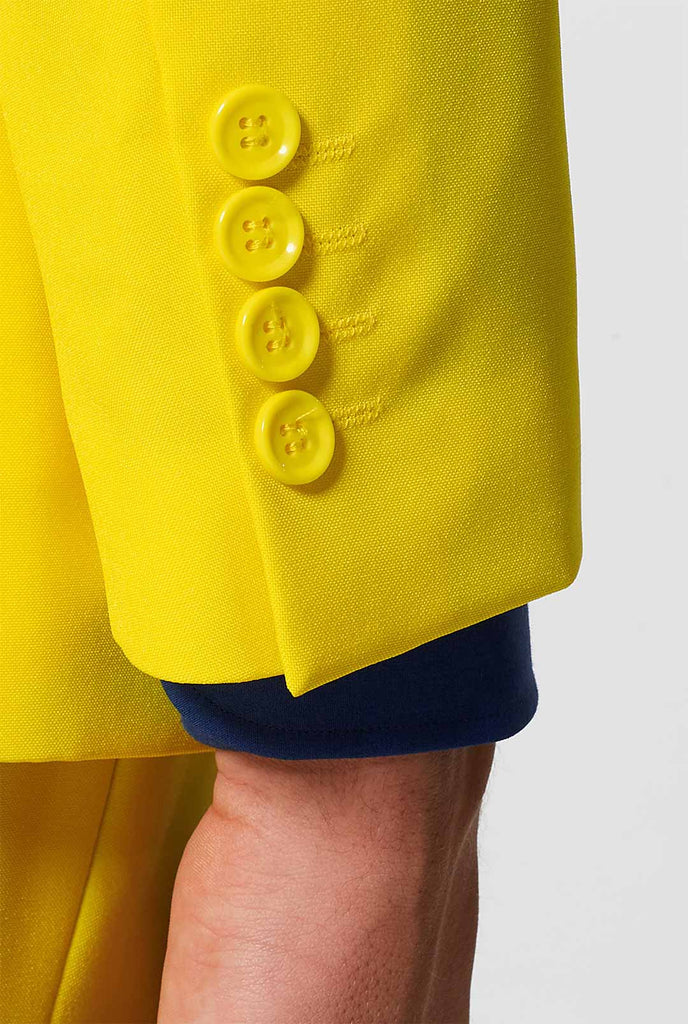 Man wearing yellow men's suit and dark blue dress shirt