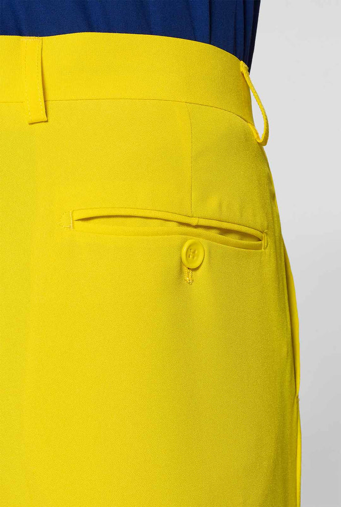 Man wearing yellow men's suit and dark blue dress shirt