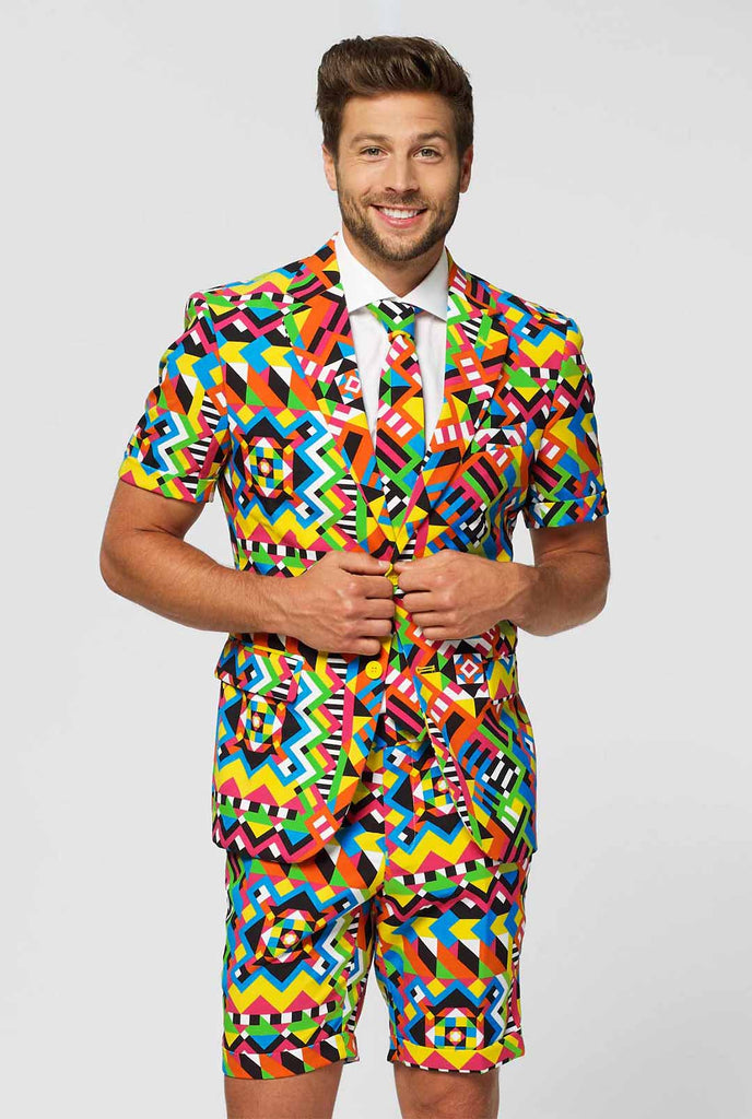 Man wearing colorful summer suit, consisting of short, jacket and tie