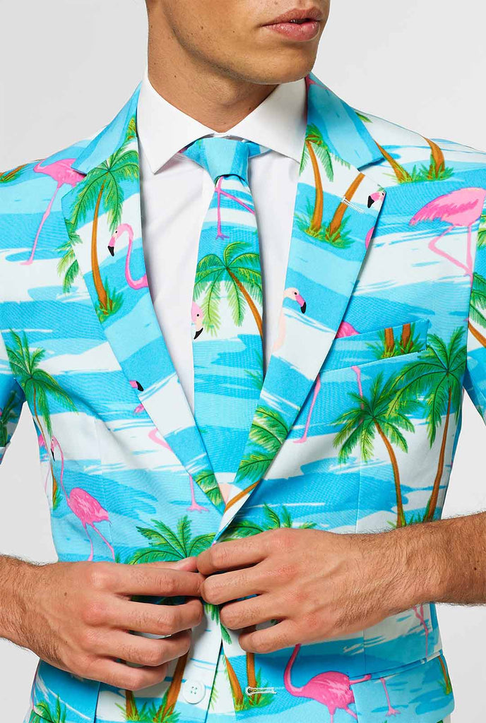 Man wearing summer suit with tropical flamingo print