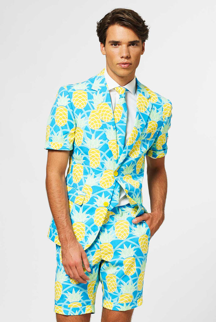 Man wearing blue summer suit with pineapple print