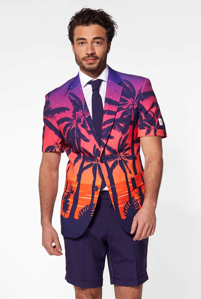 Man wearing summer suit with palms and sunset print