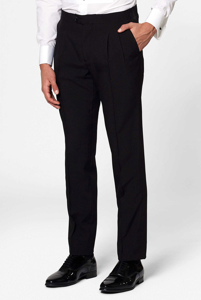 Solid black tuxedo suit Jet Set Black worn by man close up