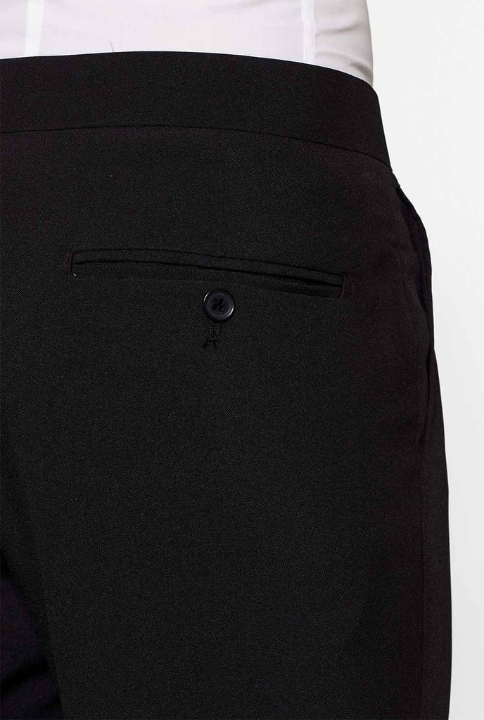 Solid black tuxedo suit Jet Set Black worn by man close up