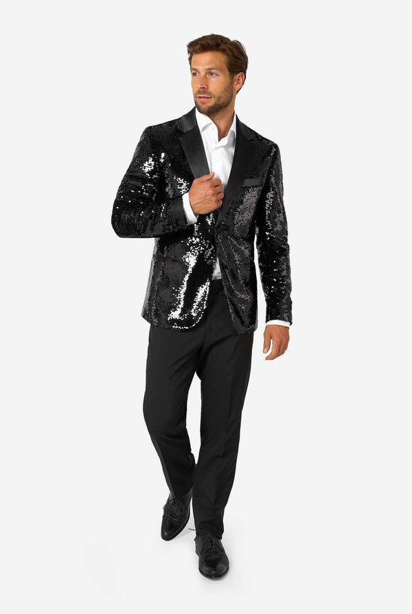 Man wearing a black sequin blazer on a white background