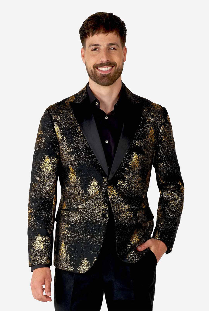Man wearing black blazer with golden Christmas tree print