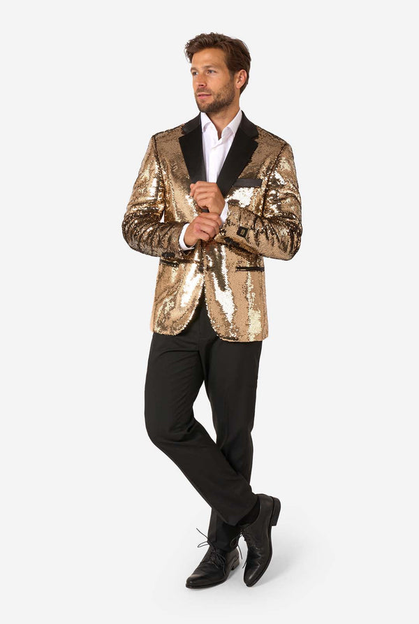 Man wearing a gold sequin blazer on a white background