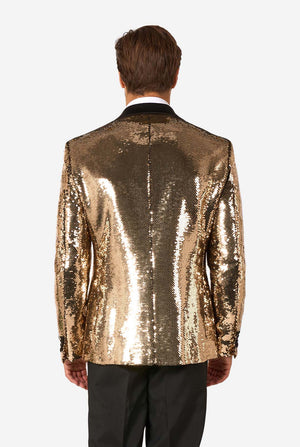 Man wearing a gold sequin jacket on a white background