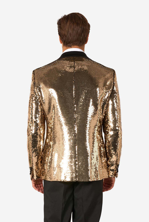 Man wearing a gold sequin jacket on a white background