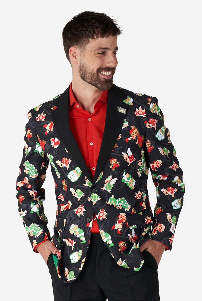 Man wearing black blazer with retro Super Mario characters print