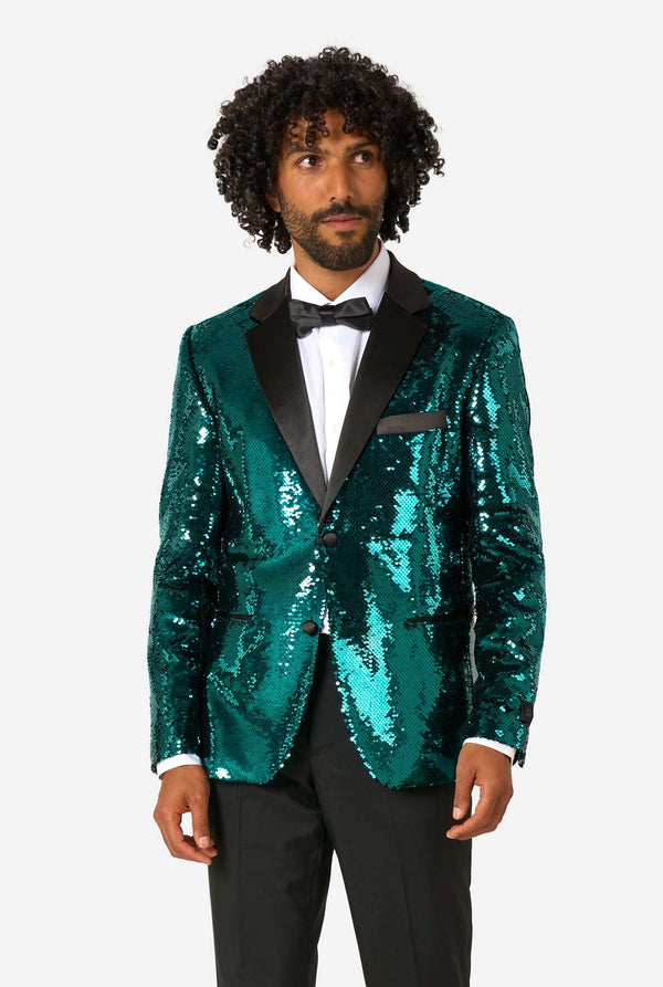 Man wearing a green sequin blazer on a white background