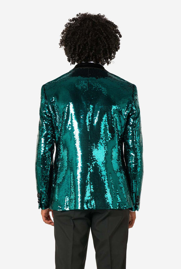 Person wearing a green sequin jacket on a white background
