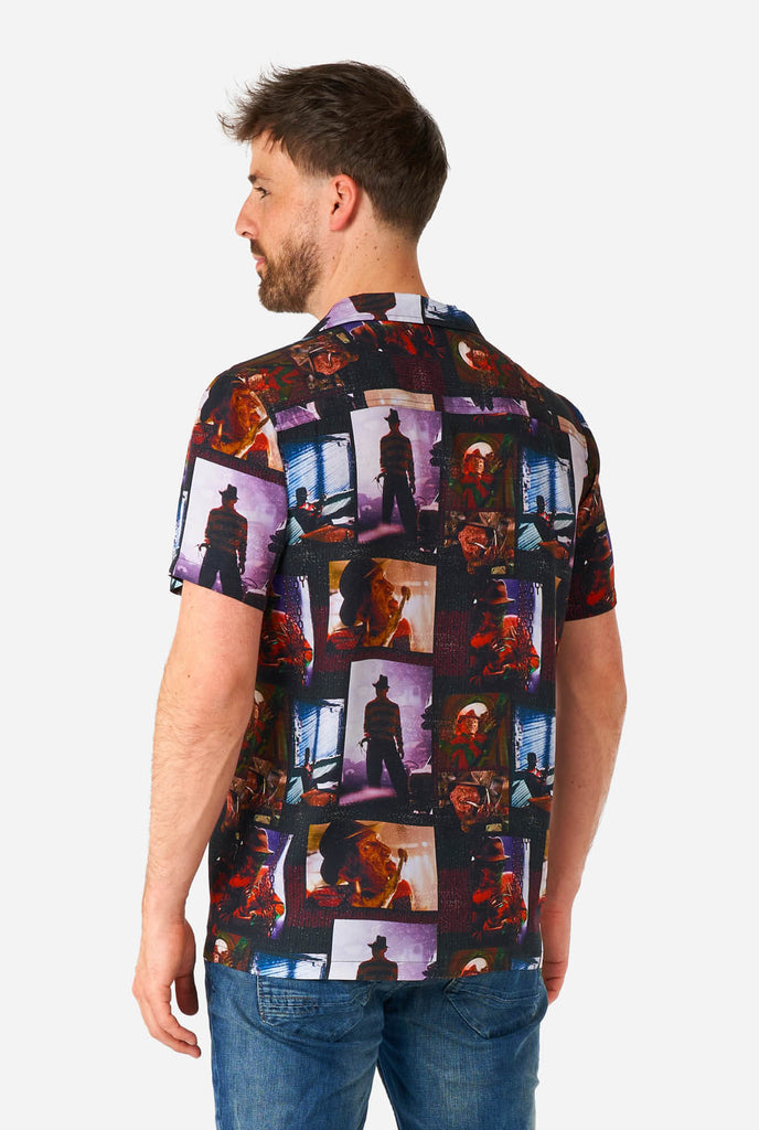 Man wearing Hawaiian Halloween Shirt with NIghtmare on Elmstreet print, view from the back