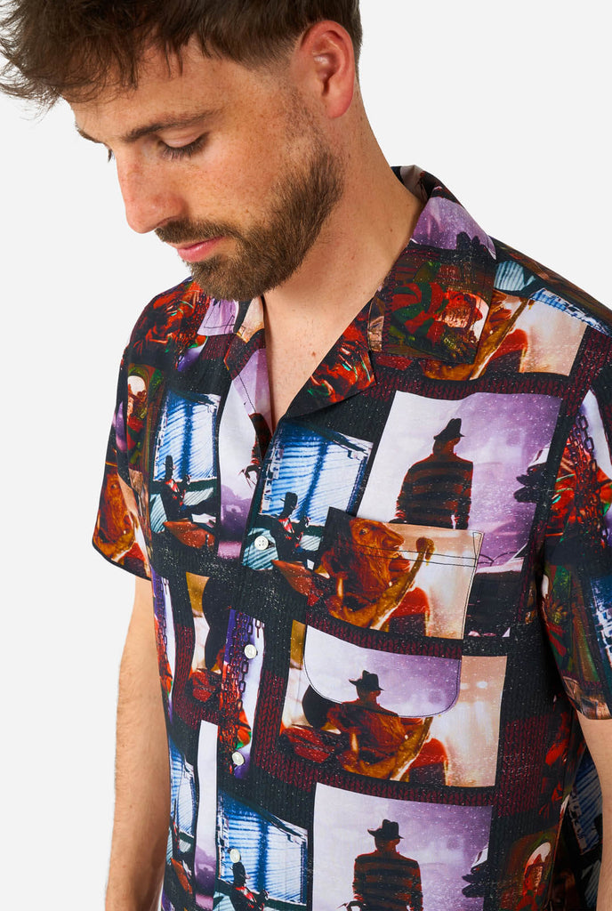 Man wearing Hawaiian Halloween Shirt with NIghtmare on Elmstreet print, close up