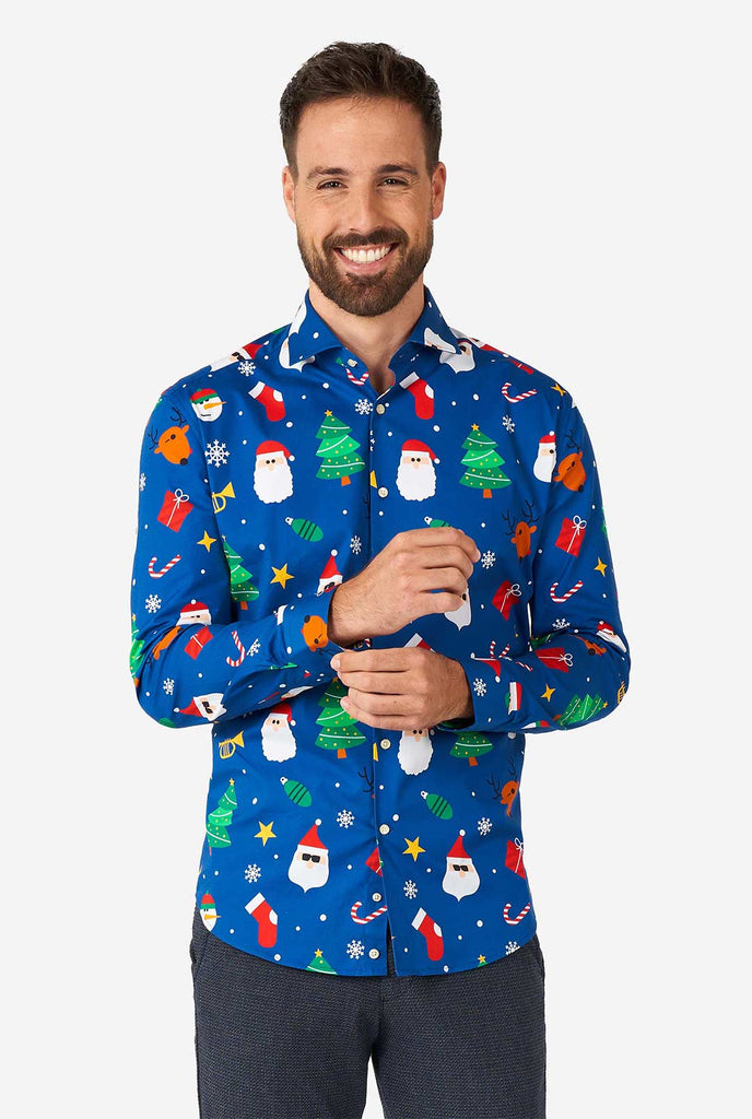 Man wearing blue Christmas dress shirt with Christmas icons